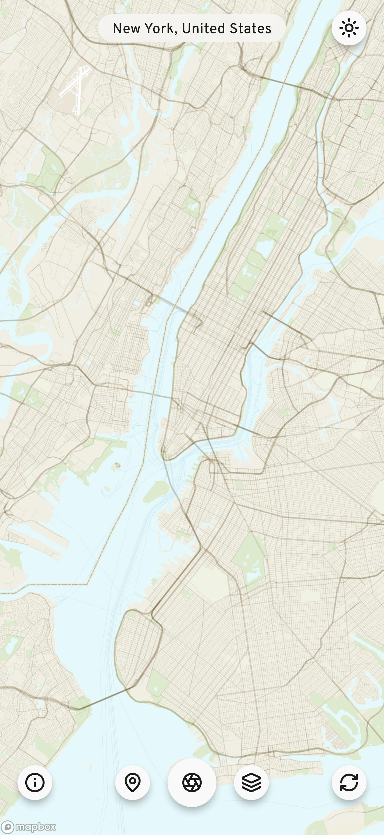 WMap main screen on iPhone: a full-screen street map of New York with a location pill reading New York, United States at the top, and a row of circular controls at the bottom for info, location, create, map layers and randomize