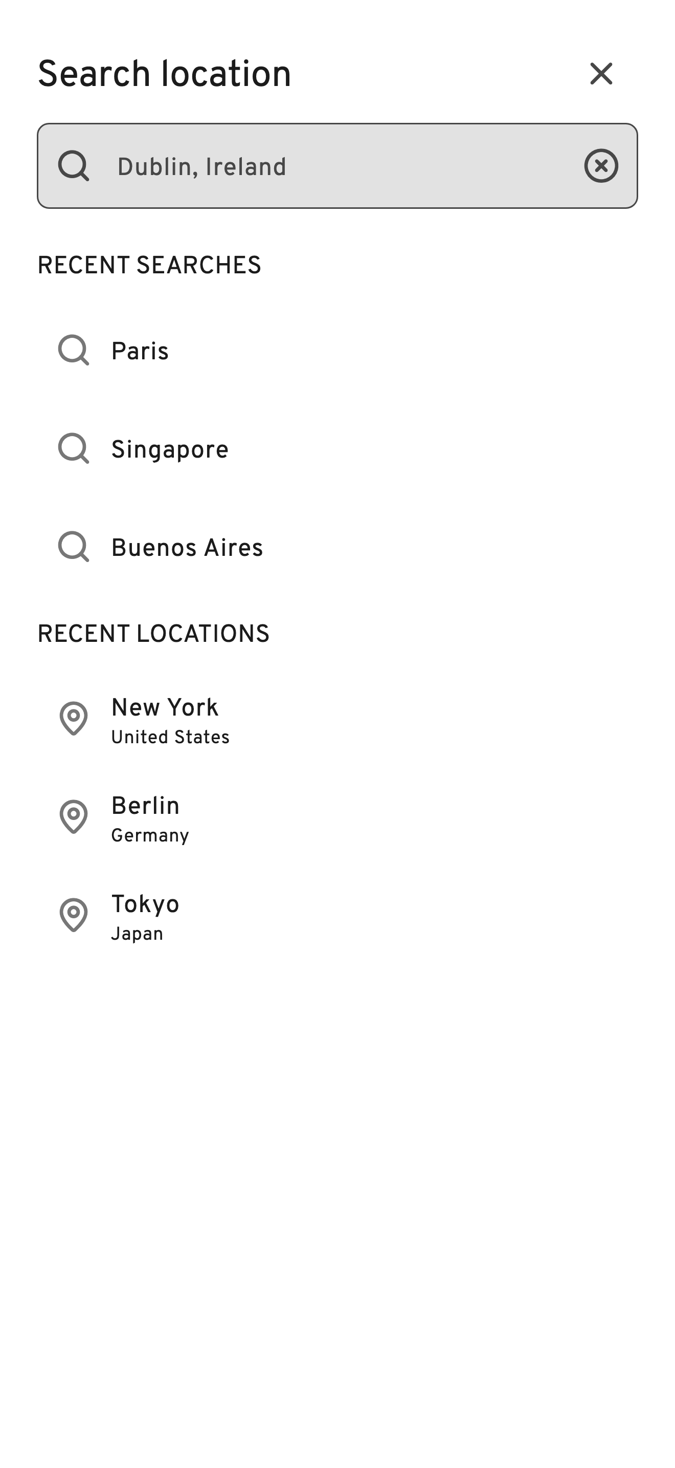WMap Search location screen on iPhone: a search field with Dublin, Ireland typed in, recent searches such as Paris, Singapore and Buenos Aires, and recent locations including New York, Berlin and Tokyo